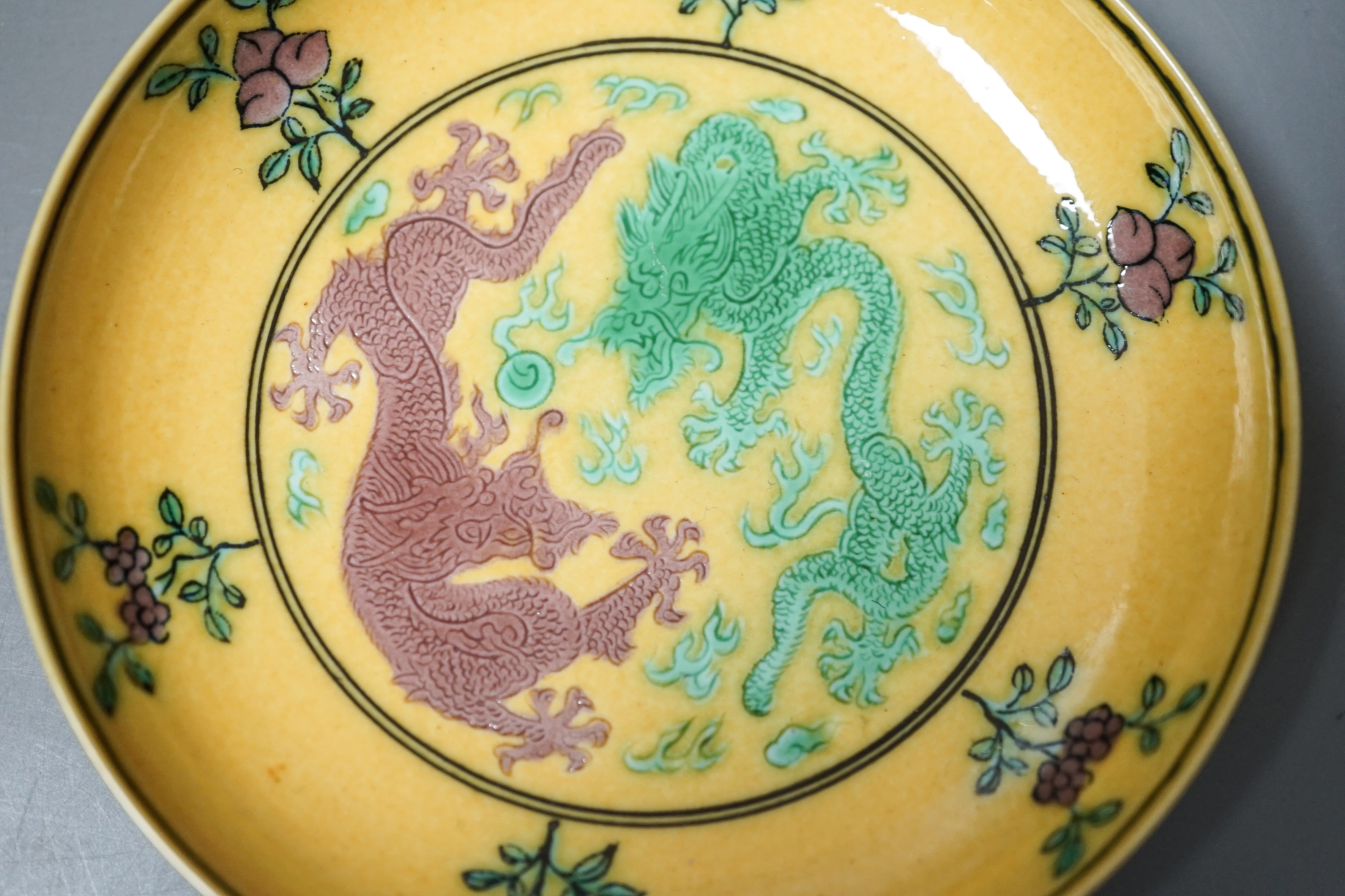 A Chinese yellow ground green and aubergine enamelled 'dragon' dish, Guangxu mark and possibly of the period, D.11cm